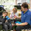 Nurse giving care to young person